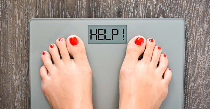 feet on a scale, with digital message 